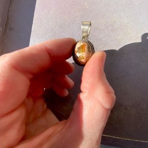 Fire opal pendent with silver engraving